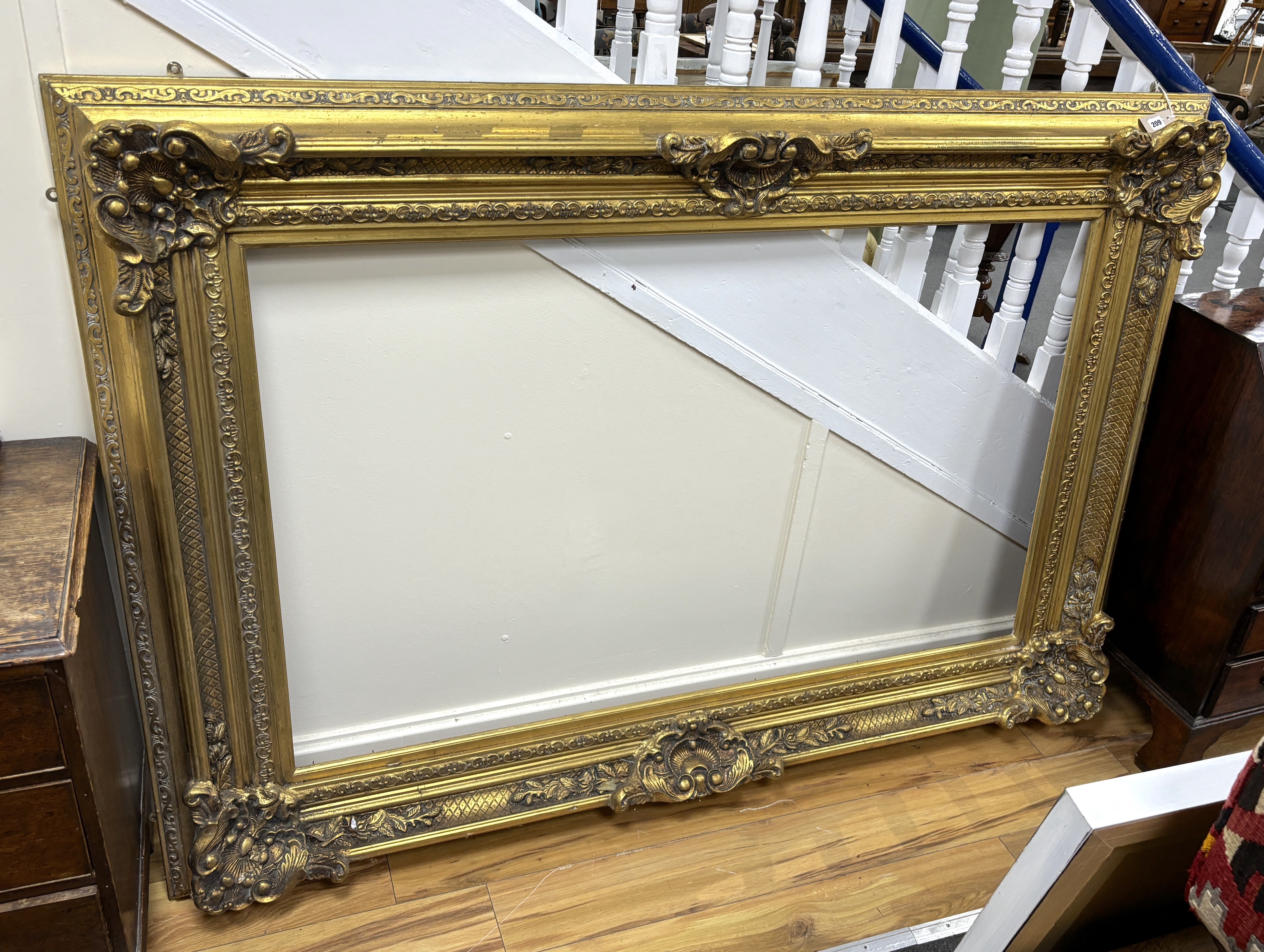 A large Victorian style rectangular gilt frame, width 192cm, height 133cm